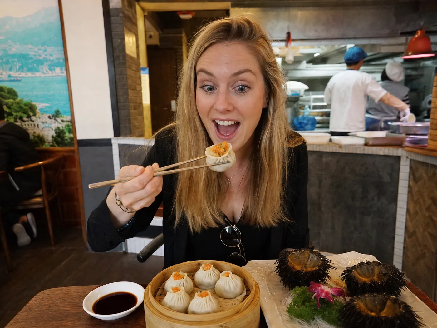 Traveler eating sea urchin dumplings