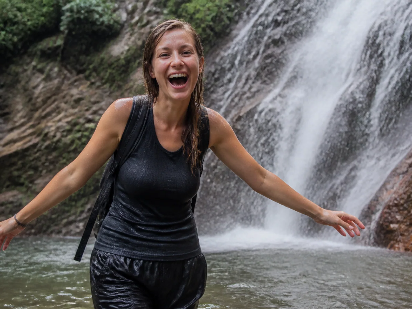 Hikers at waterfall