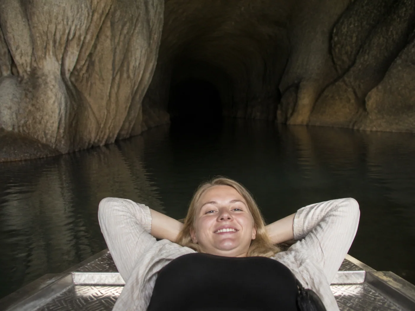Travelers on cave entry boat