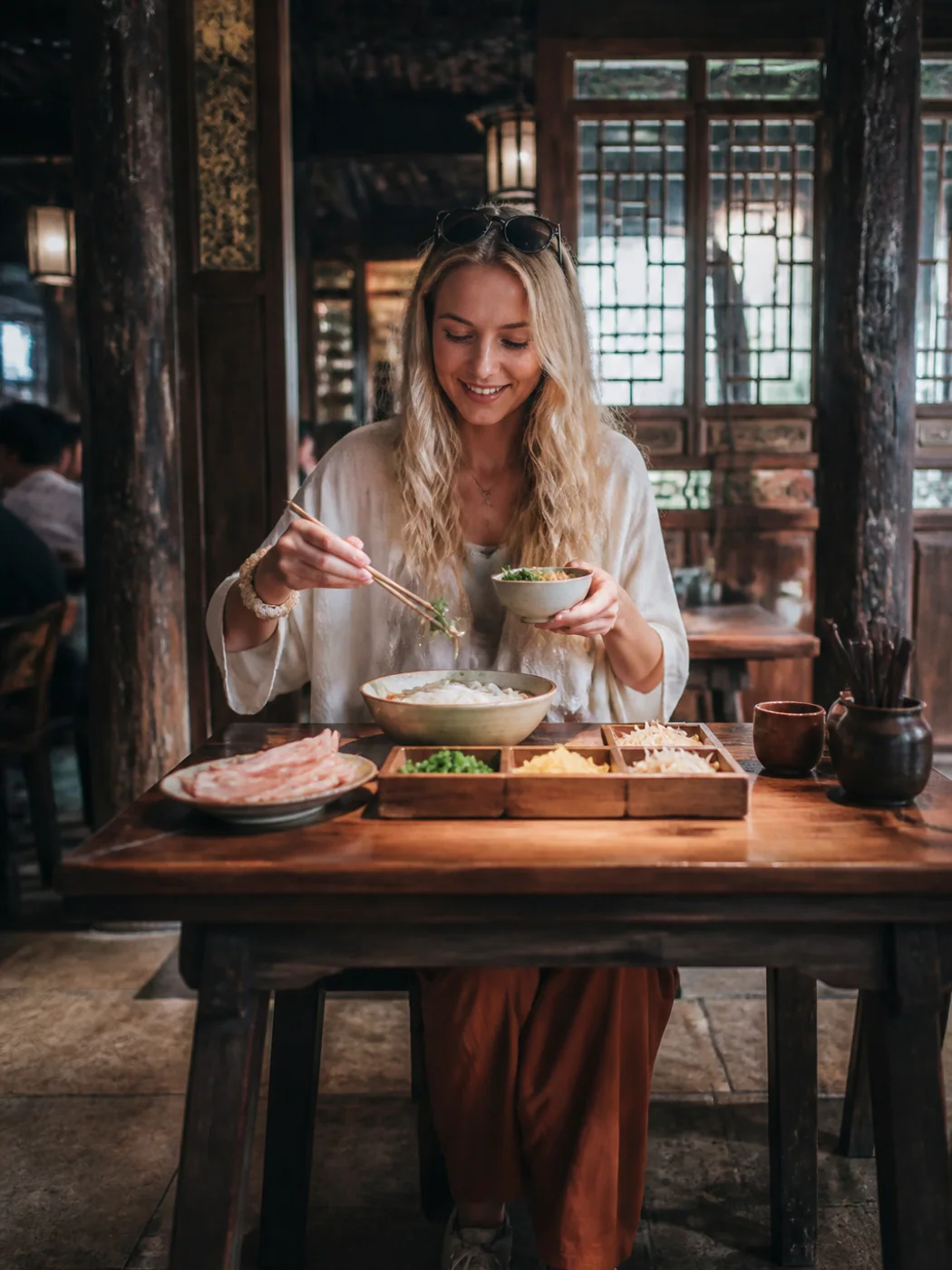 Traveler assembling Yunnan noodles