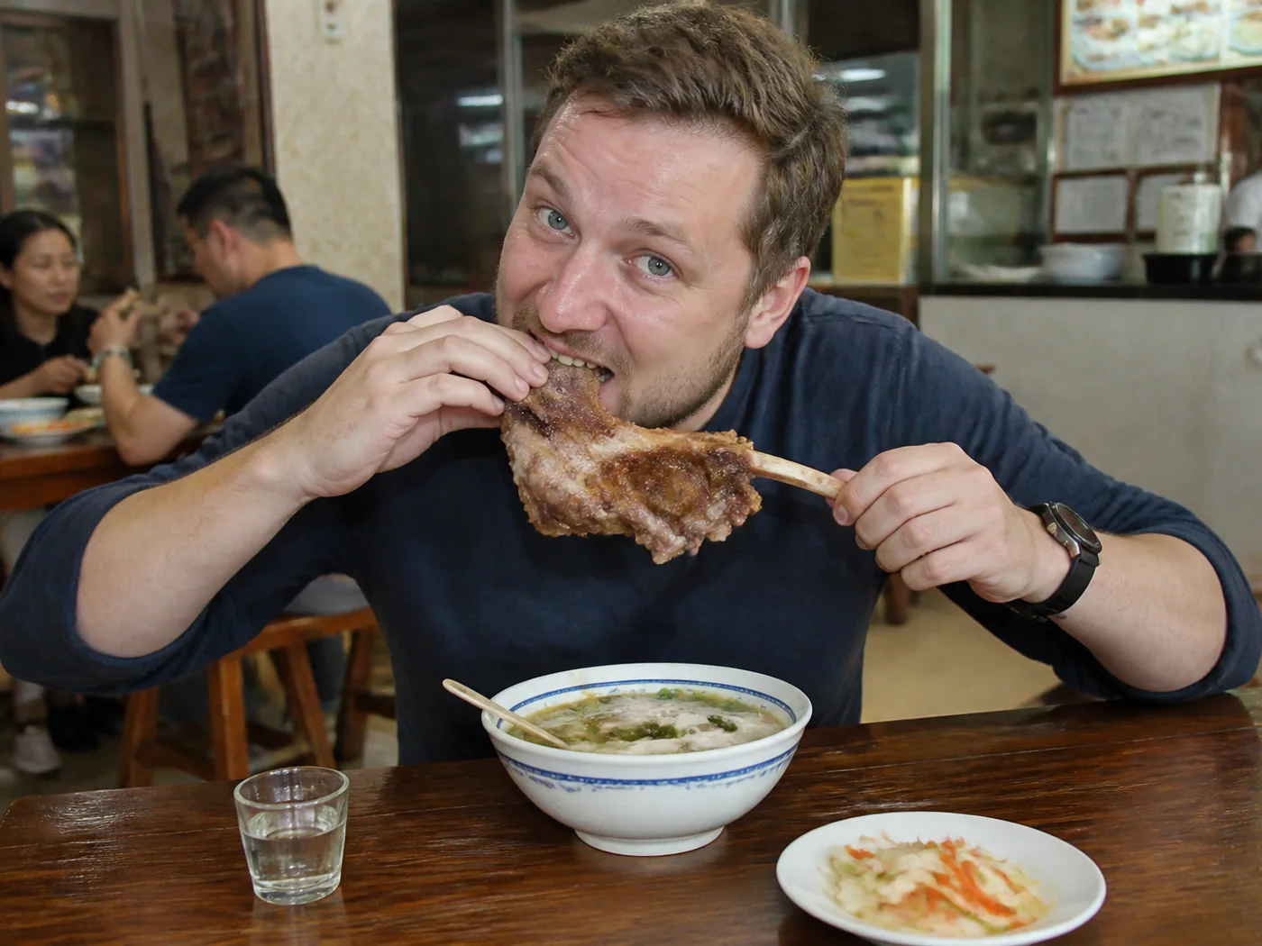 Travelers eating hand-grabbed lamb