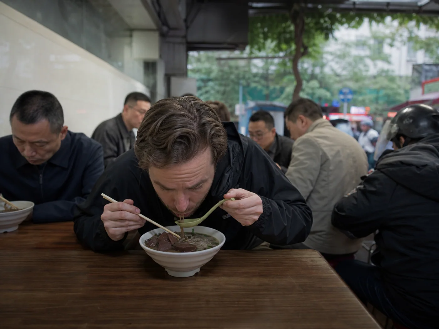 Traveler eating duck blood soup