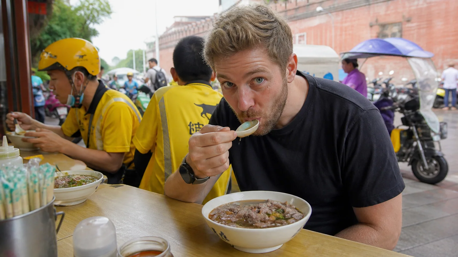 Traveler eating beef soup breakfast