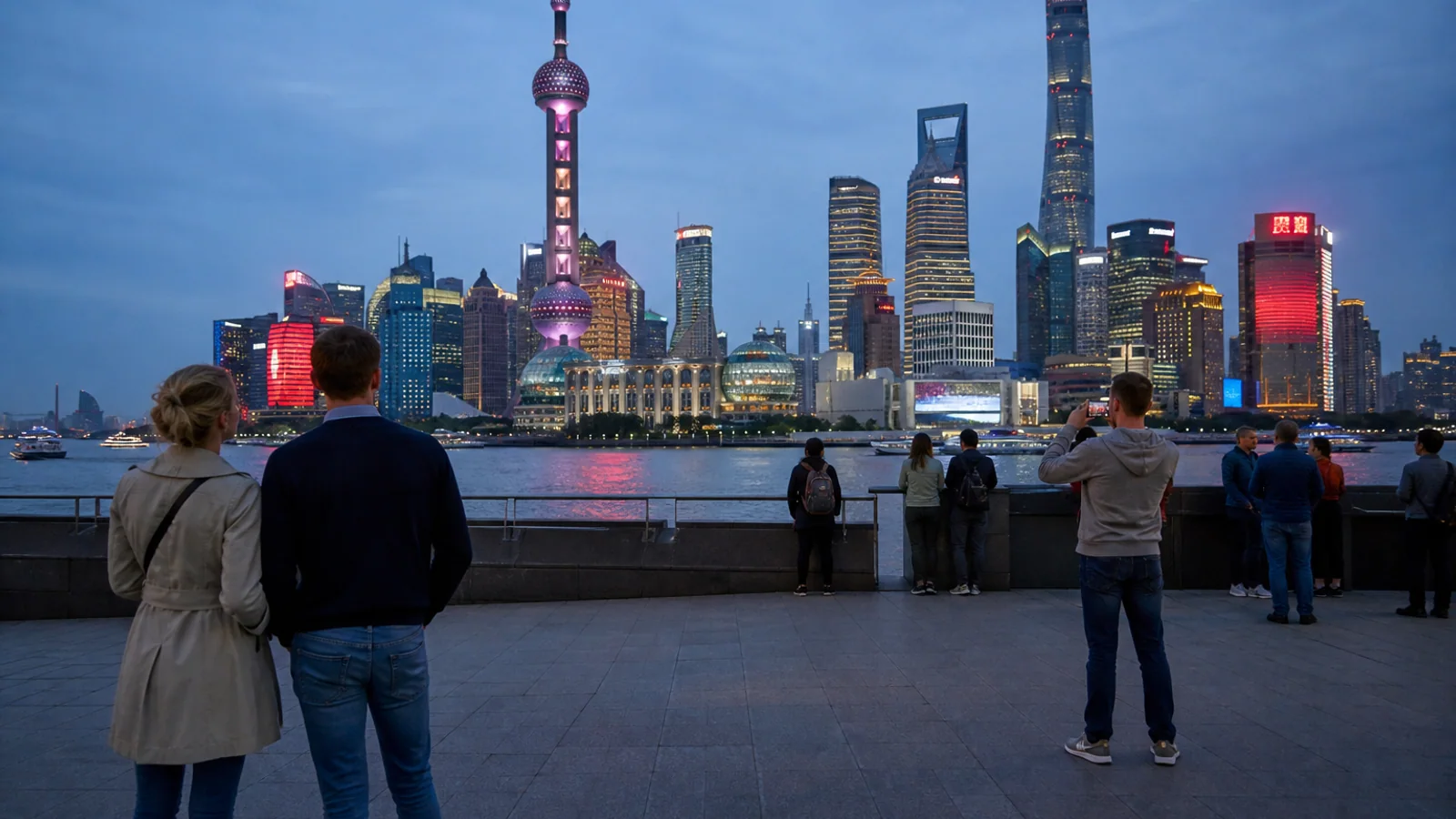 Travelers watching Shanghai skyline at night