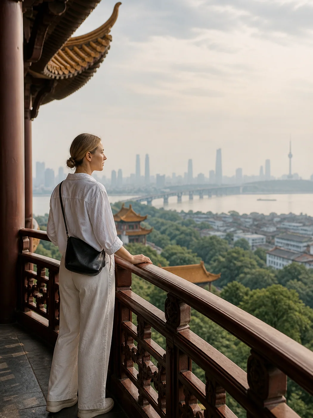 Travelers overlooking Wuhan and the Yangtze from a tower balcony