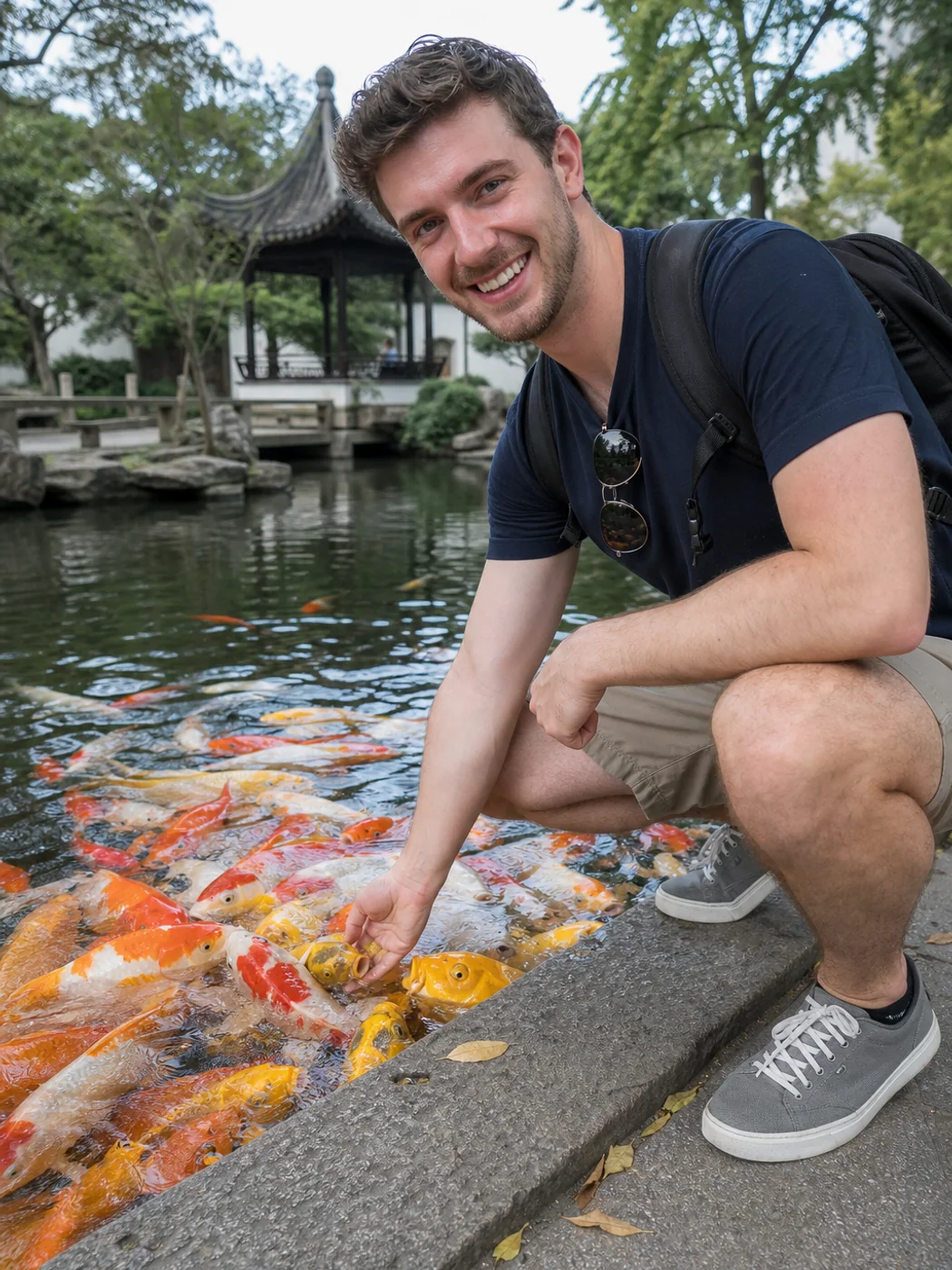 Traveler feeding fish in Wuxi garden